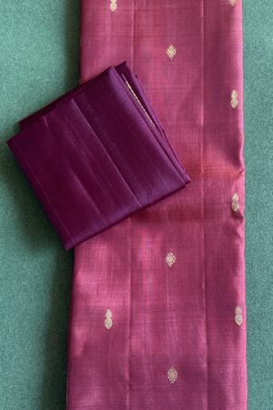Rust color small border with a dark maroon blouse